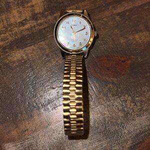 Timex gold tone mother of pearl face watch